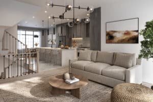 Open-plan living area with beige sofa, round wooden coffee table, and kitchen with dark wood cabinetry